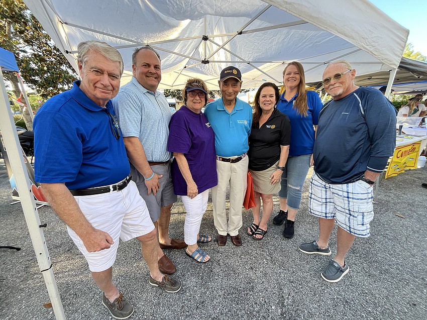 Rotary Club of Lakewood Ranch members Ted Lindenberg, Ryan Brems, Sybil Porter, Govind Singh, Christi Womack Villalobos, Marie Thompson and Jim McFarland share the club's various projects. Porter, who is the president, says it's a lot of fun talking to the community and promoting the club.