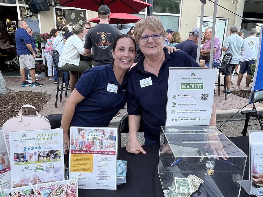 Stefanie Guido and Kathy Ditting man the Meals on Wheels Plus of Manatee booth, sharing the nonprofit's mission and various programs.