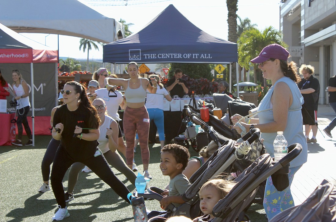 The moms and babies have fun during Fit4Mom classes.
