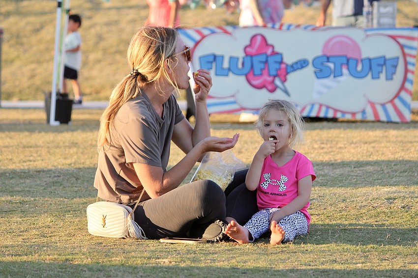 Kaye and Veda Dixon enjoy some popcorn before the movie.