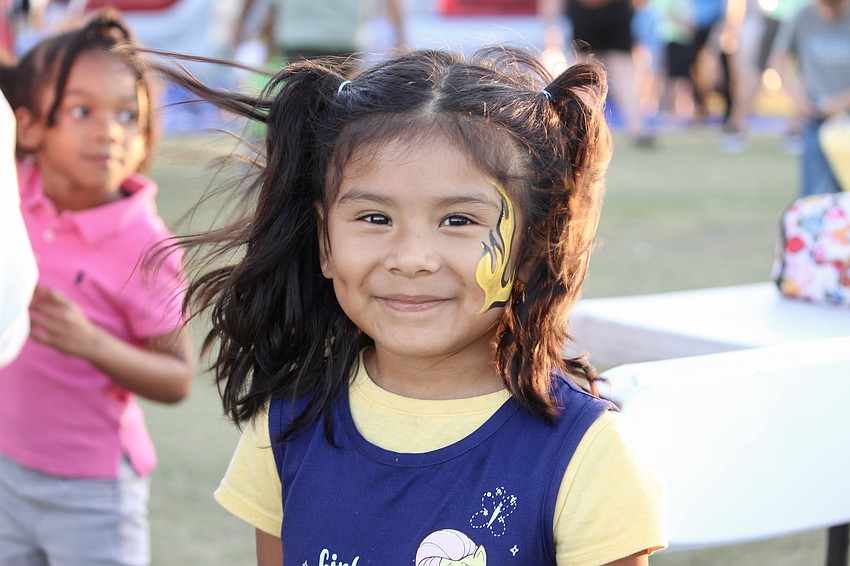 Alejandra Garcia chooses a flame for her face painting.