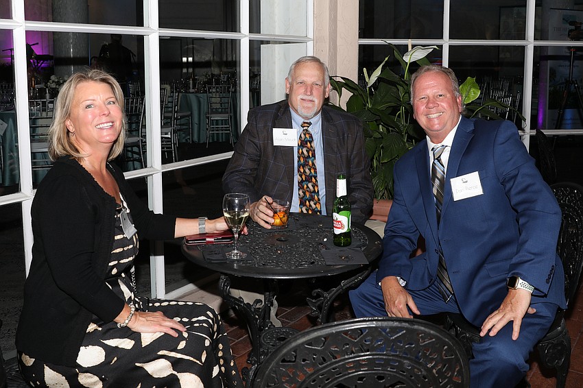Carrie Grubb, Alan Meudt and Dan Pierce enjoy the cocktail hour.