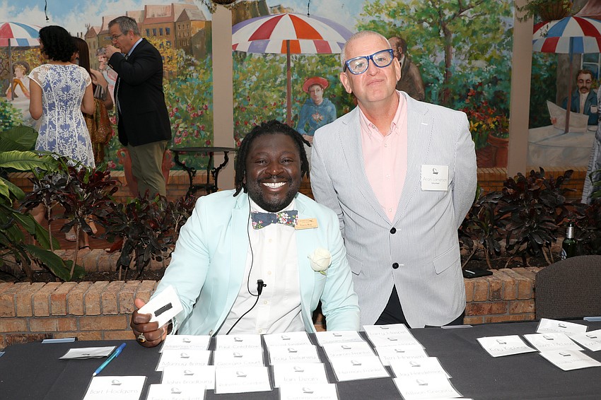 Travis Ray and Aron Lamerson work the check-in table at Michael's On East.