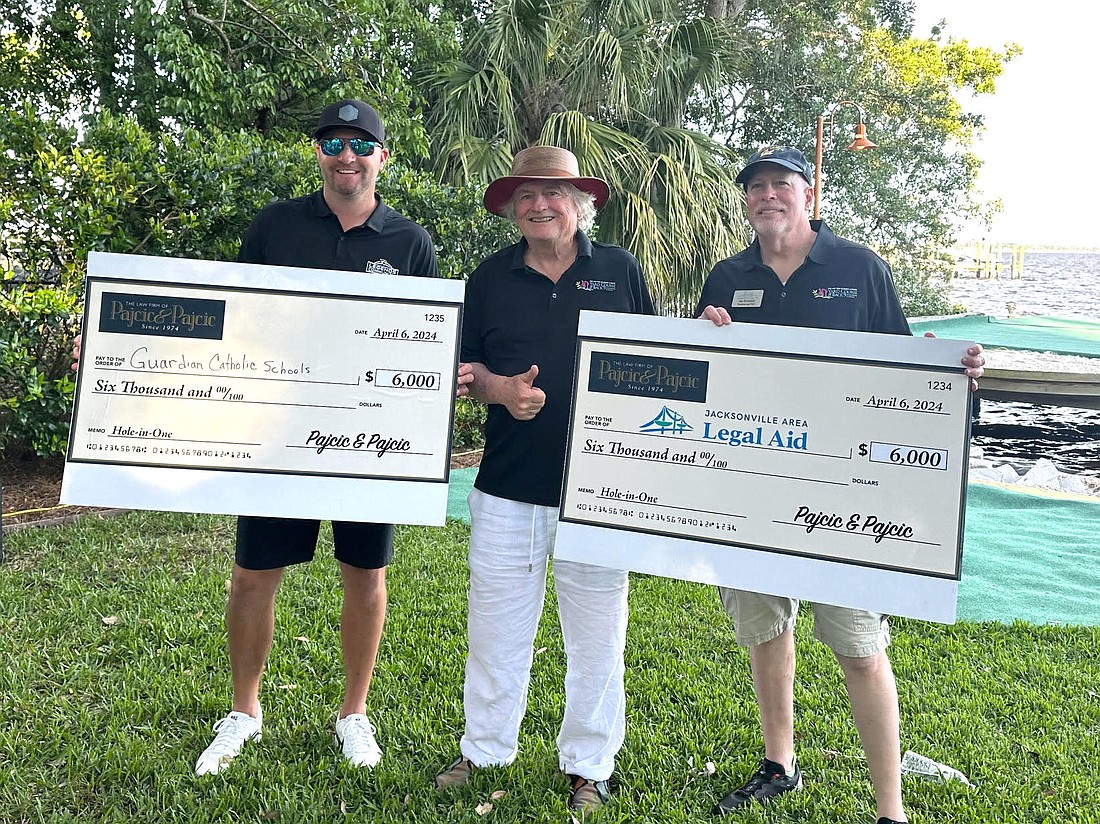 From left, former Jacksonville Jaguars kicker Josh Scobee, attorney Steve Pajcic and Jacksonville Area Legal Aid President and CEO Jim Kowalski. Scobee won the celebrity closest to the pin competition at the 10th annual Pajcic & Pajcic Yard Golf Tournament on April 10. The Pajcics donated $6,000 to Scobee’s selected charity, Guardian Catholic Schools, and matched it with a $6,000 donation to JALA.
