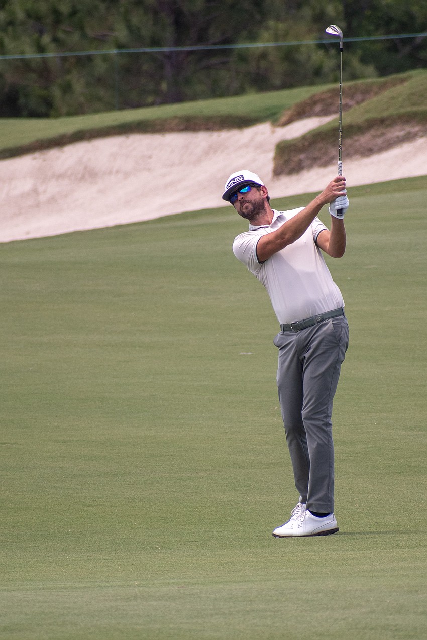 Scott Harrington hits a chip shot on the No. 9 hole at Lakewood National Golf Club during the first round of the 2024 LECOM Suncoast Classic. Harrington finished the round five under par.