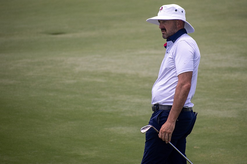 Rhein Gibson watches his chip shot on the No. 9 hole at Lakewood National Golf Club during the first round of the 2024 LECOM Suncoast Classic. Gibson finished the round two under par.