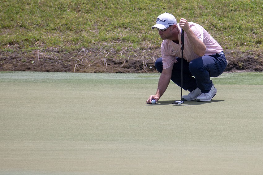 Dan McCarthy lines up his putt on the No. 9 hole during the first round of the 2024 LECOM Suncoast Classic at Lakewood National Golf Club. McCarthy shot one over par.
