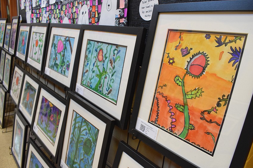 Students' artwork is on display throughout the hallway.