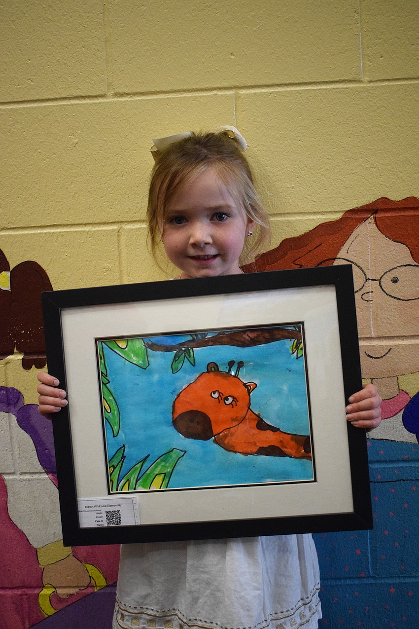 Kindergartner Zyla Jo Piercy shows off her artwork.