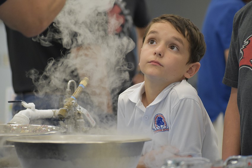 Fourth Grader Elijah Frederick watches a demonstration by Sub Zero Nitrogen Ice Cream.