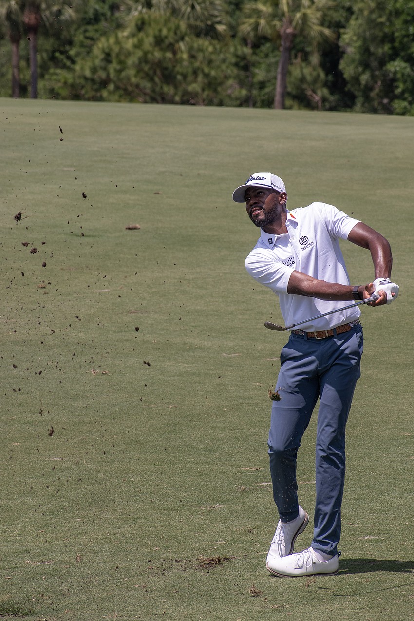 Kamaiu Johnson kicks up dirt and grass on his second shot on the No. 1 hole at Lakewood National Golf Club during round two of the 2024 LECOM Suncoast Classic. Johnson shot one over par Friday and is five under par for the tournament.