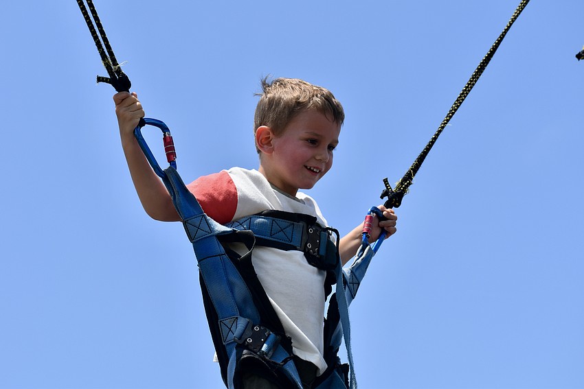 Lakewood Ranch resident Miles Bliss, 3, tries out the bungee trampoline.