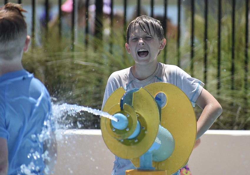 Sarasota resident Liam Reilmann hits his target during Waterside Park's grand opening April 20.