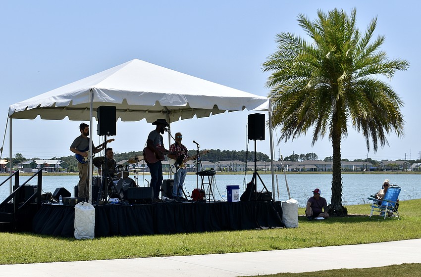 The Jessie Daniels Band provides the music for the grand opening.