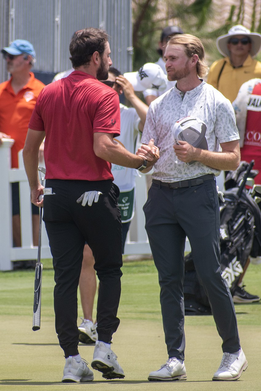 Cristobal Del Solar and Danny Walker shake hands following their third rounds in the 2024 LECOM Suncoast Classic, held at Lakewood National Golf Club. Walker, a Lakewood Ranch High graduate, shot eight under par in round three, tied for the day's best performance. Walker finished the tournament tied for 20th at 14 under par.