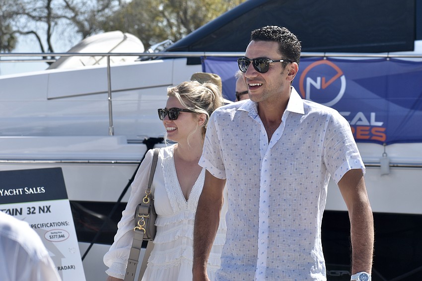 Carlye Crabtree and Yamen Elsaid walk along the dock.