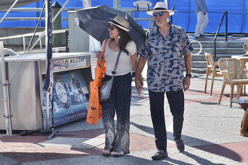 Lisa Kleinberg and Ira Azneer stroll through the boat show.