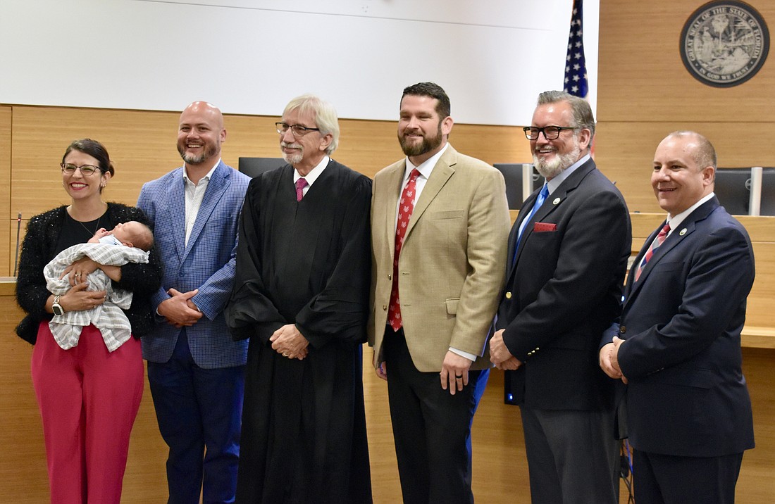 Fellow commissioners attend James Satcher's swearing in as the new Supervisor of Elections. From left to right: Amanda Ballard, Jason Bearden, Judge Gilbert A. Smith Jr., James Satcher, Mike Rahn and Kevin Van Ostenbridge.