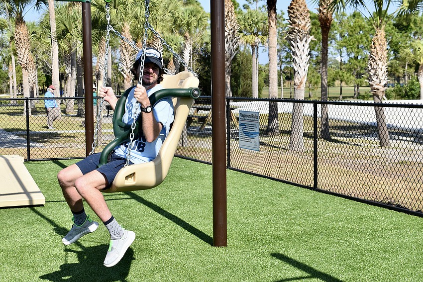 Aktion Club member Matthew Griffin tries out the zip line.