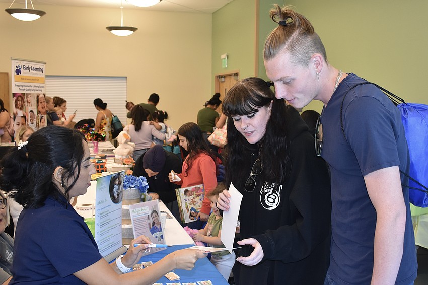 Stefanny Leon of Sarasota Medical Pregnancy Center talks with Sierra Smith and Logan Sylvia.