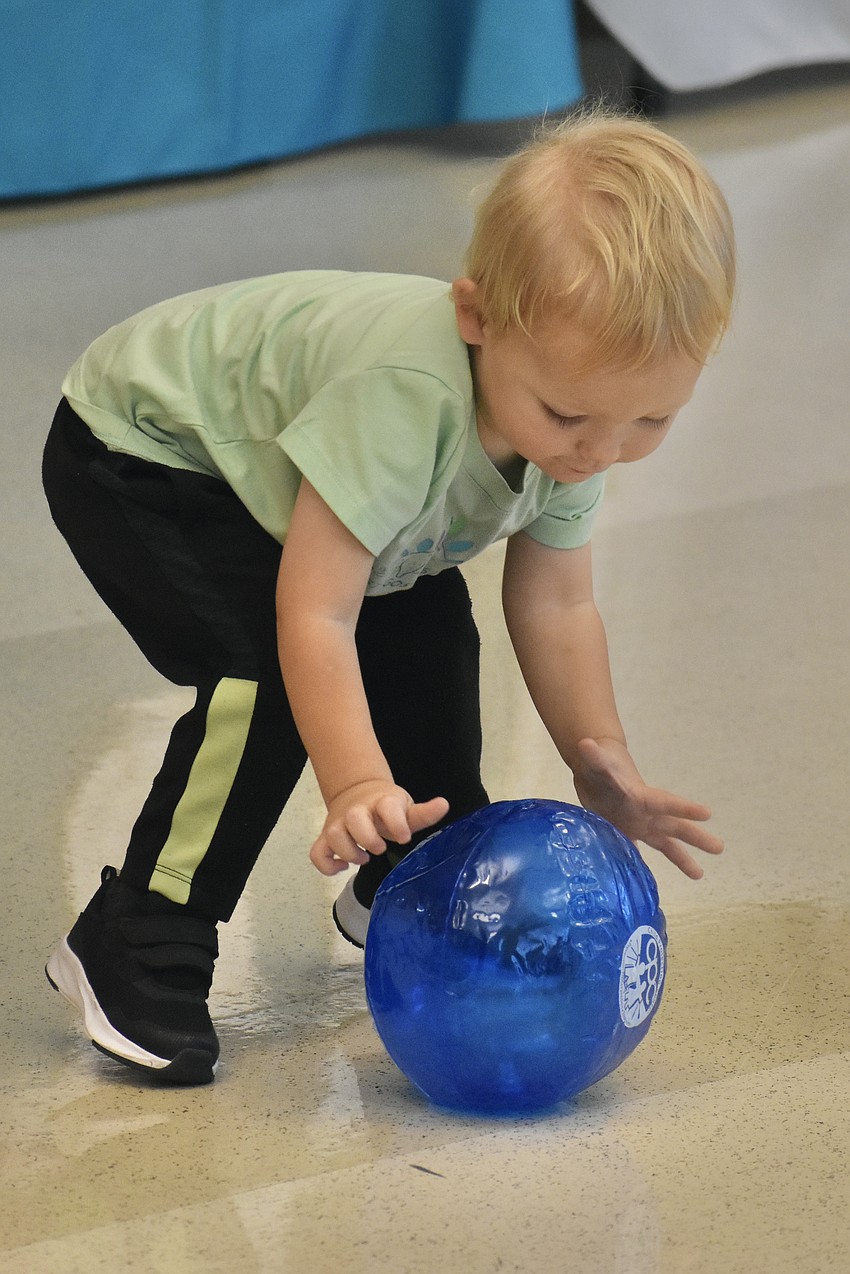 Calico Becker, 1, enjoys playtime while at the event.