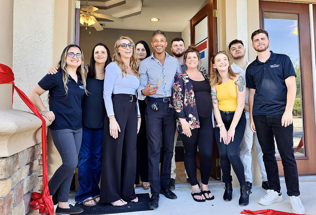 The team at the Your Home Sold Guaranteed Realty franchise branch, owned by Jesse Warmka. Photo by Sierra Williams