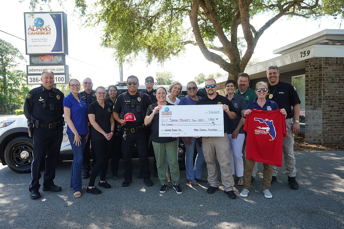 The Adams Cameron Foundation presented Ormond Beach Police with a $500 donation on Friday, April 26, for its upcoming torch run event. Photo courtesy of Pauline Dulang/OBPD