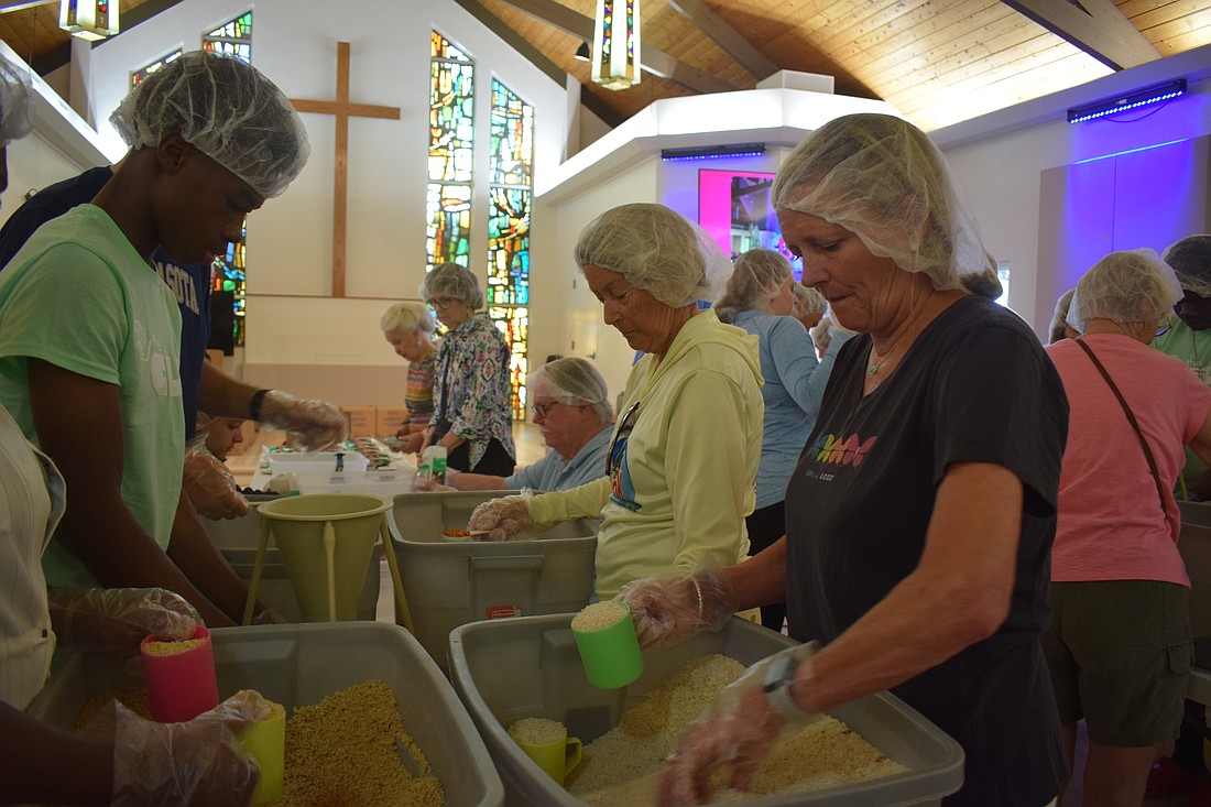 Joan Elder packing meals