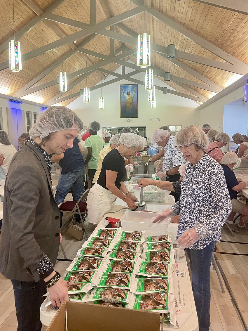 Andrew Cox packing meals