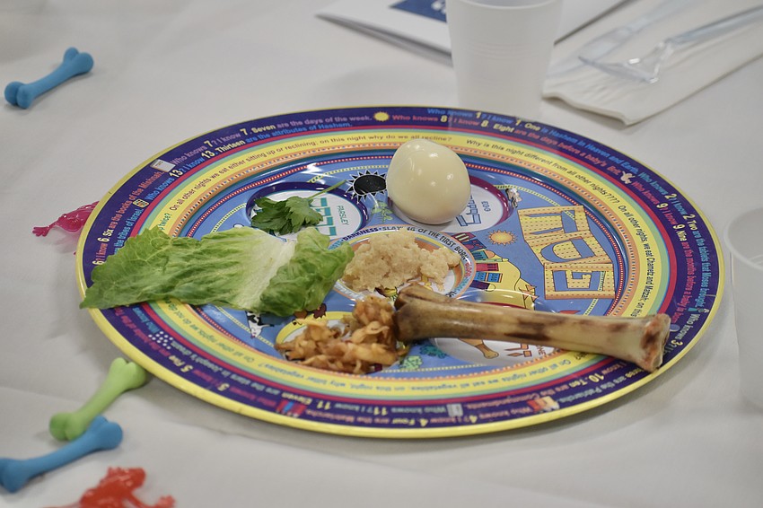 The tables were set with Passover Seder plates.
