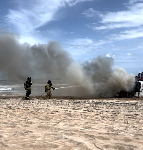 Ormond Beach firefighters extinguish Jeep on fire near the Granada Boulevard beach approach. Screenshot of video provided by city of Ormond Beach