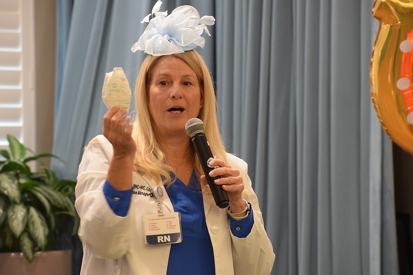 Lisa Biach, a clinical case manager in Sarasota Memorial Hospital's neonatal intensive care unit, shares the size of diapers babies in the unit use while talking about the NICU.
