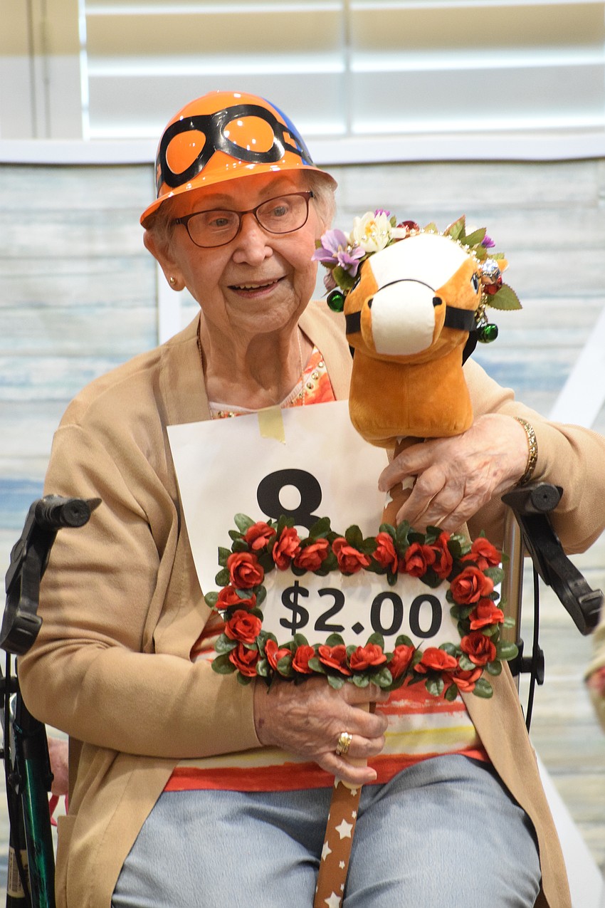 Every time Grand Living at Lakewood Ranch's Audrey Kubitski's number is called, someone pays $2.