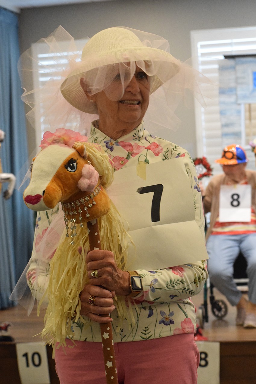 Grand Living at Lakewood Ranch's Ellie Stoddard and her horse, Powder Puff, anxiously wait to hear their number called so they can claim victory.