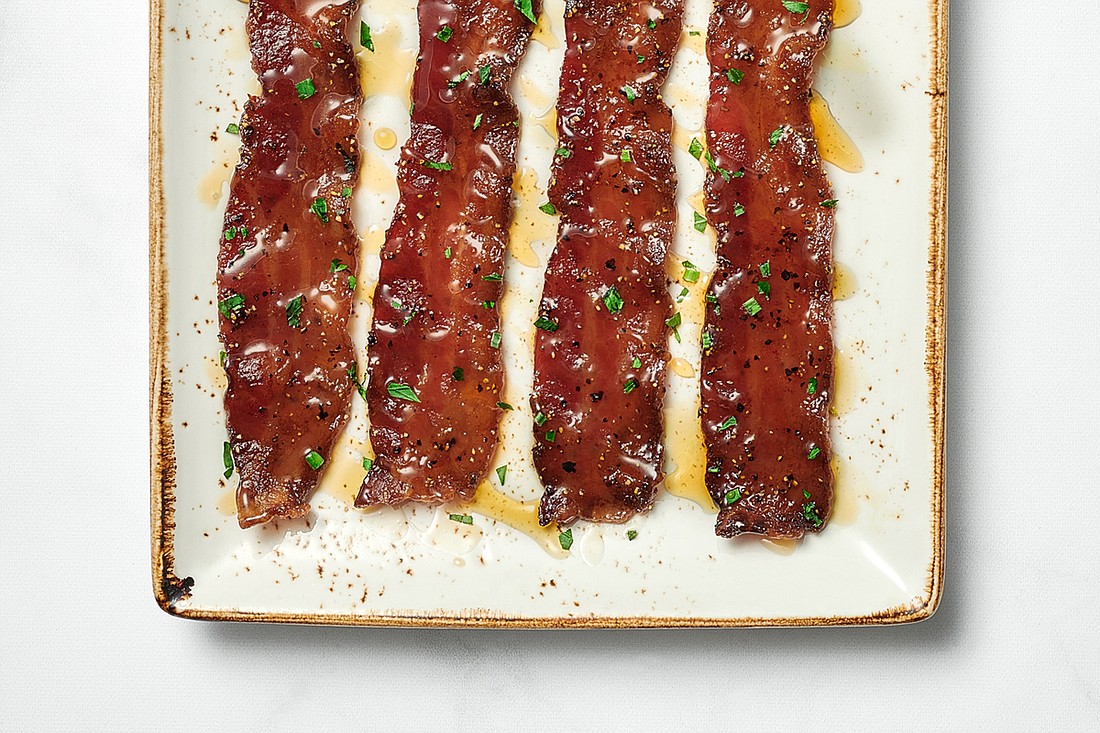 Million-dollar bacon is among the fan favorites on its menu, according to First Watch. It features bacon cooked with brown sugar, black pepper, cayenne and a maple syrup drizzle.