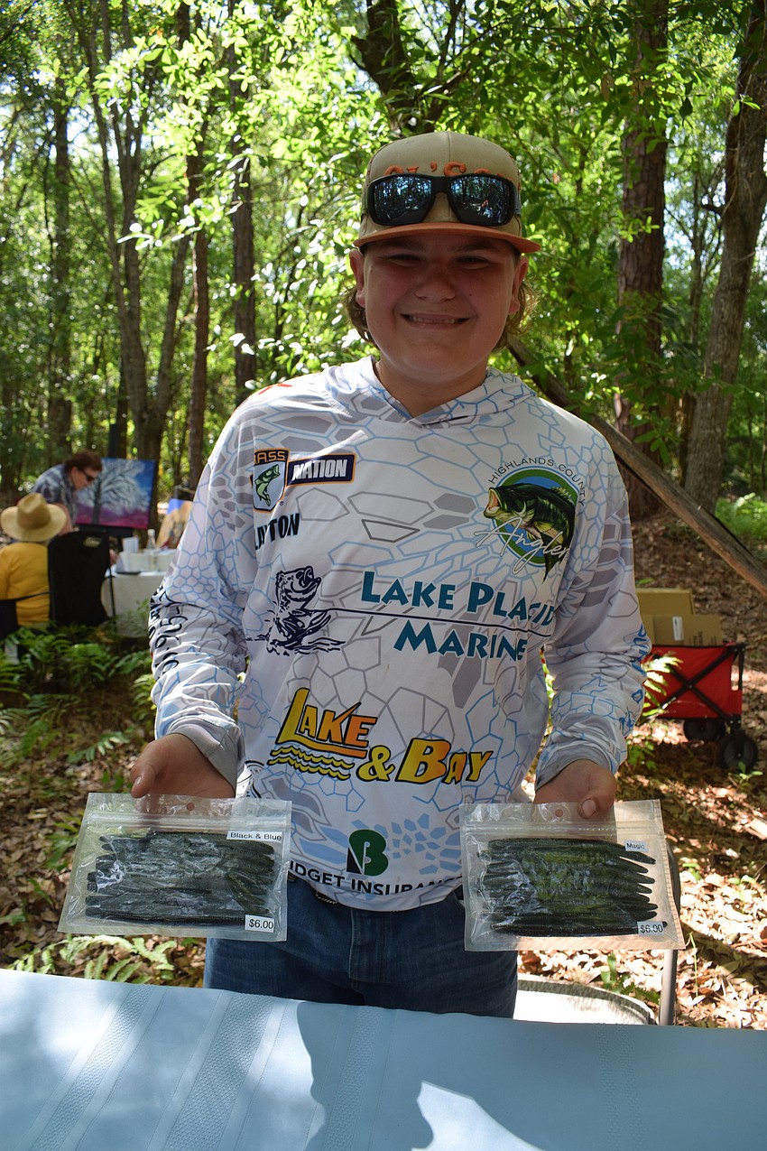 Clayton Reagan, an eighth grader at Carlos E. Haile Middle School, sold out of the fishing worms he created halfway through the two-hour Artists on the Path event.