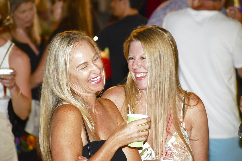 Julia Griffin and Melissa Parker enjoy the vibes on Palm Avenue.