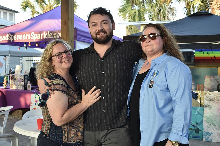 Lori England, Joshua Hardinger and Lori England's wife Mica England. The owner of Blvd Cafe in Sarasota, Mica England is known for her lawsuit against the Dallas Police Department filed in 1990, which succeeded in changing its hiring policy towards gays and lesbians as well as laws criminalizing homosexuality in North Texas.