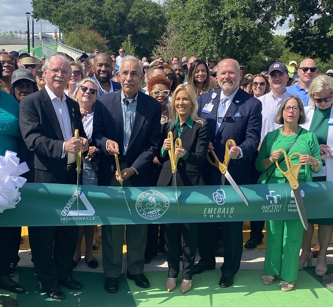 Before a crowd that included elected officials, community advocates, bicyclists and health professionals, supporters of the Emerald Trail cut the ribbon on the LaVilla Link portion of the trail on May 6. From left to right are U.S. Rep. John Rutherford, R-Florida, Jacksonville City Council President Ron Salem, Mayor Donna Deegan, Michael Mayo, president and CEO of Baptist Health, and Kay Ehas, CEO of Groundwork Jacksonville.