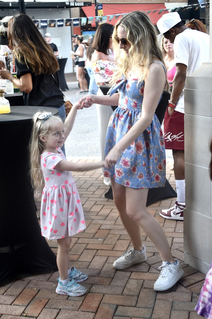 Ariya Butler, 4, dances with Savannah Lyddy