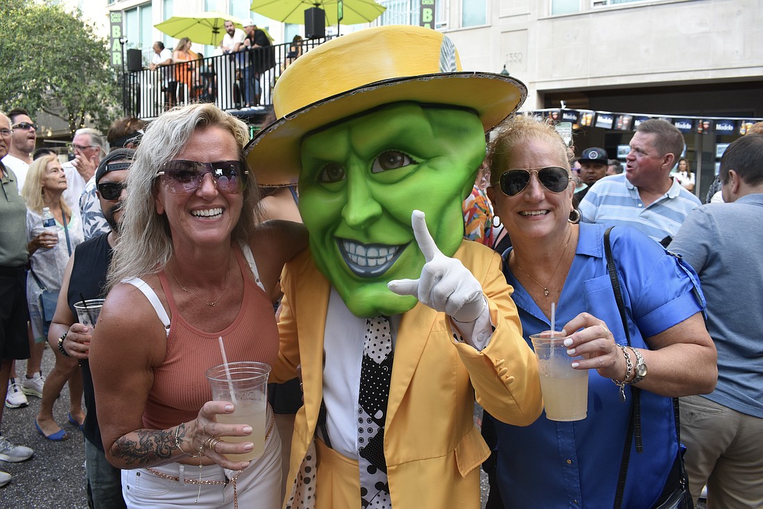 Emmanuelle Nobert, performer from Karen's Hora Loca dressed in a costume based on "The Mask," and Deirdra Sampson