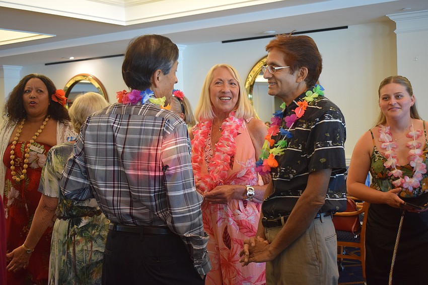 Femcity of Sarasota hosts a Hawaiian-themed party for its spring fashion show on May 2.