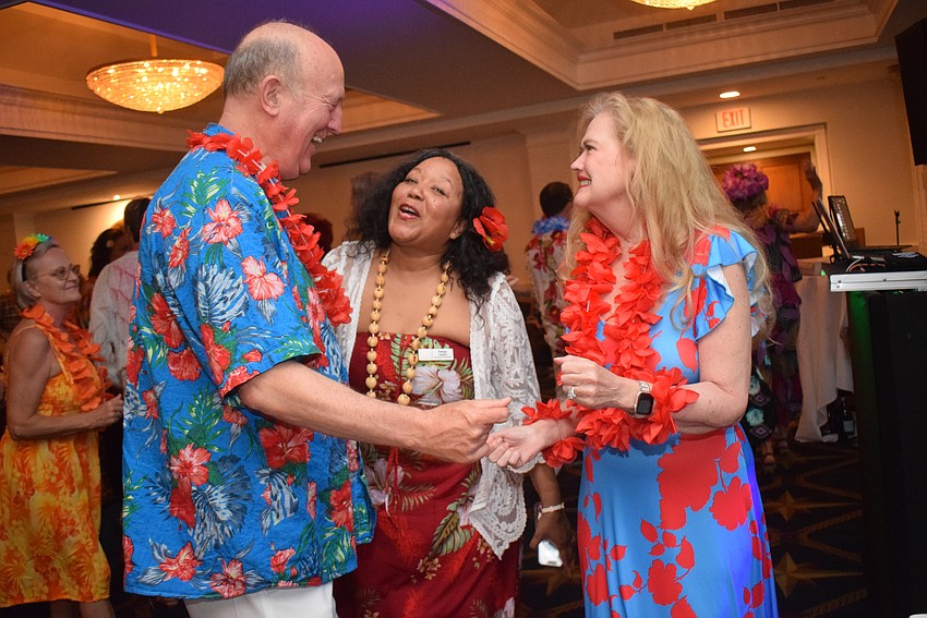 Femcity of Sarasota hosts a Hawaiian-themed party for its spring fashion show on May 2.