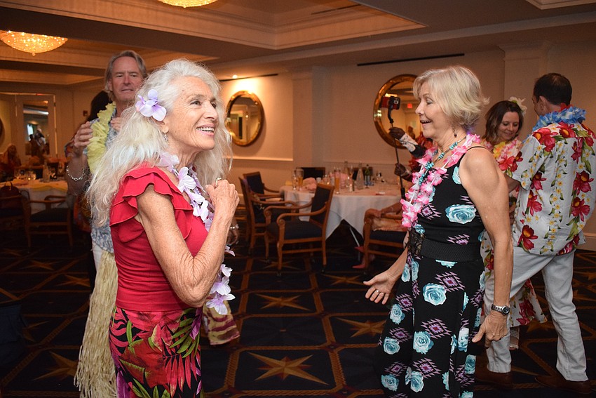 Femcity of Sarasota hosts a Hawaiian-themed party for its spring fashion show on May 2.