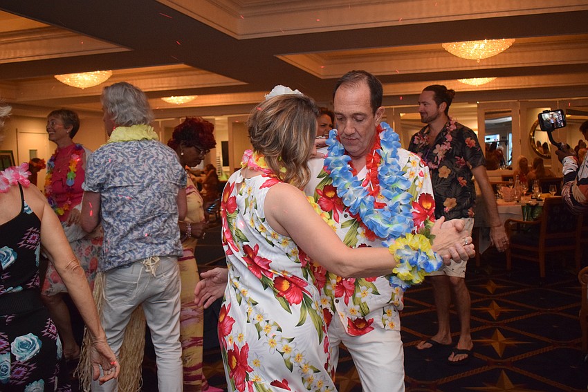 Femcity of Sarasota hosts a Hawaiian-themed party for its spring fashion show on May 2.