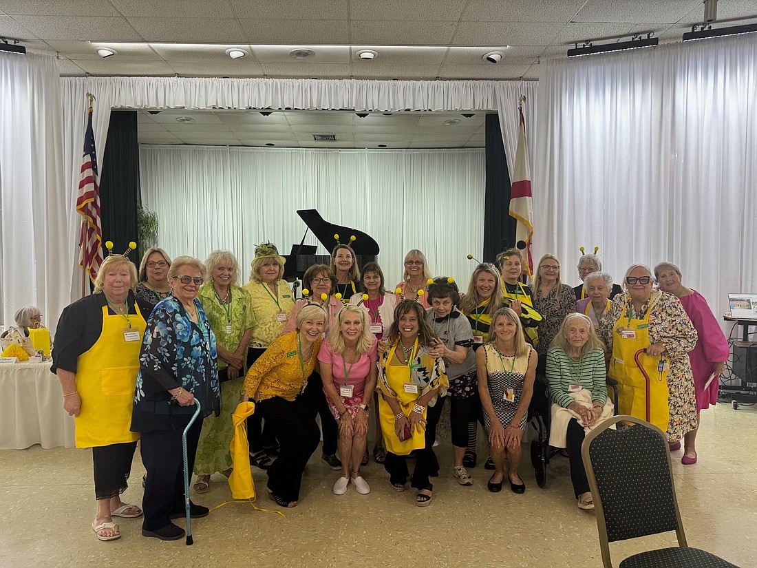 In celebrating the importance and awareness of respecting bees, Tillandsia members wore bee costumes and antennae. Courtesy photo