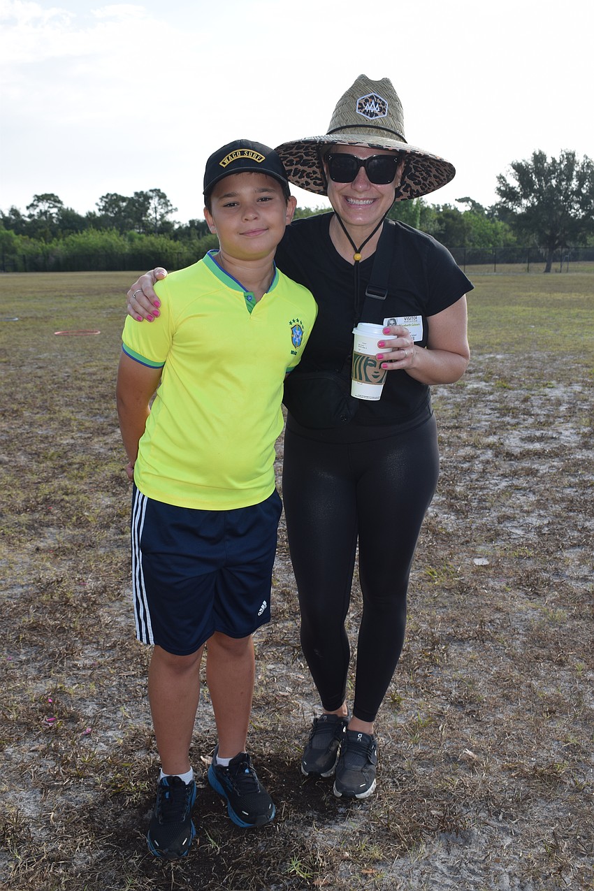 Fourth grader Carson Calasans and his mother, Liz Calasans, say they've been practicing water balloon tosses at home to prepare for field day. 
