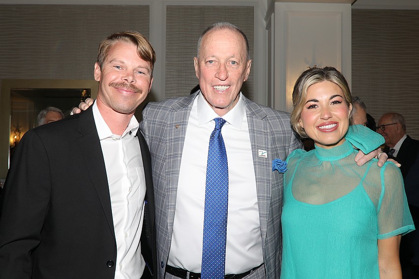 Oral cancer survivor and pro Football Hall of Fame Member Jim Kelly (center) with Chad Balyo and Lynden Blake