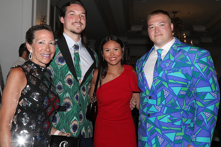 Tammie Johnson and her dapperly donned sons, Charlie and Zack, with Taylor Castro