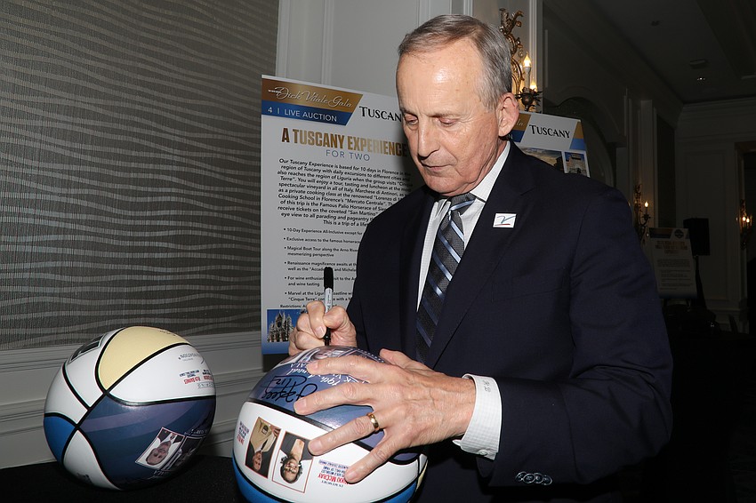 University of Tennessee Volunteers basketball head coach Rick Barnes signs basketballs at the Dick Vitale Gala.